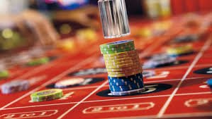 Wizard casting spells with magical symbols appearing on fantasy slot reels